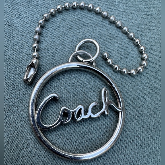 Coach Circular Silver Keychain
Coach Silver Circle Keychain – Timeless Elegance - Picture 11 of 16